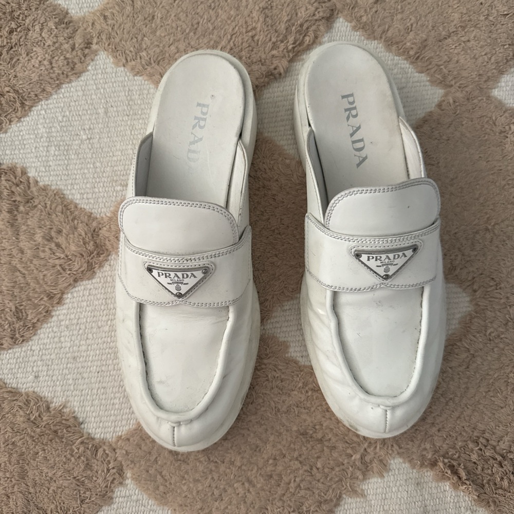 Prada White Leather Mules with Metal Logo